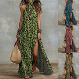 Woman wearing a  leopard print maxi dress with a split front and halter neck