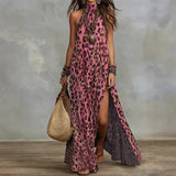 Woman wearing a pink leopard print dress with a neutral background