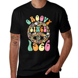 Black t-shirt with colorful 'Groovy Since 1966' design.