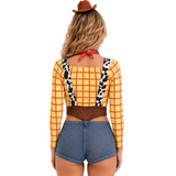 A woman shown from the back wearing a cowgirl costume top with a yellow and red plaid pattern, cow-print suspenders, a brown waistband, and a red neck tie, paired with denim shorts and a brown hat against a light gray studio background.
