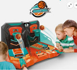 Children playing with a basketball game console on a white background