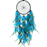 Dreamcatcher with blue feathers on a white background