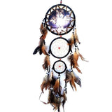 Dreamcatcher with feathers on a white background