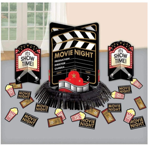 Movie night-themed decorations with clapperboard and movie theater elements on a gray surface.