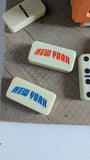 Dominoes with 'New York' text