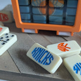 Domino tiles with 'Knicks' branding.