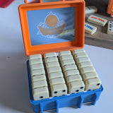 Set of dominos in a blue and orange container withNew York Knicks logo.